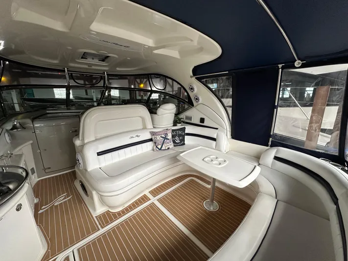  Yacht Photos Pics Luxurious 2007 Sea Ray 44 Sundancer interior with elegant seating and table.