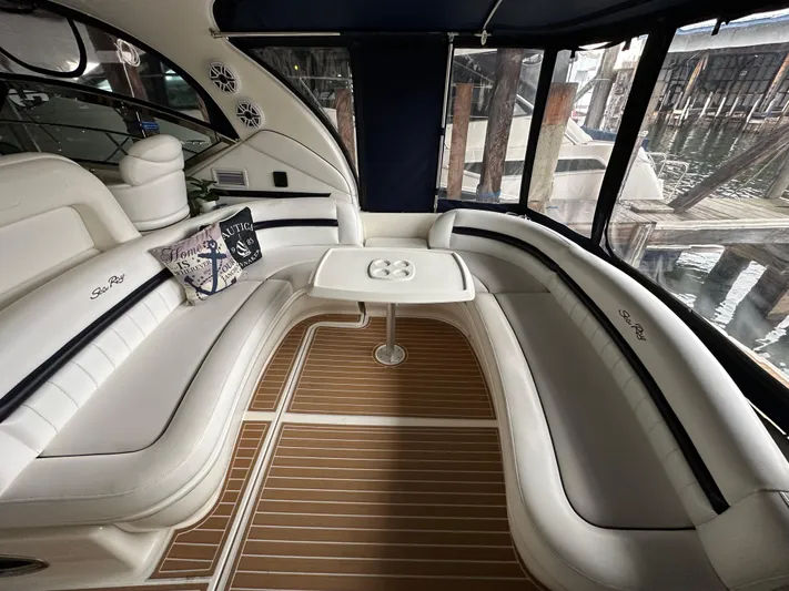  Yacht Photos Pics Luxurious 2007 Sea Ray 44 Sundancer interior with white seating and wooden flooring.