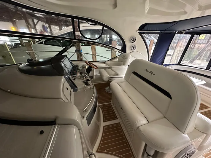  Yacht Photos Pics Luxurious 2007 Sea Ray 44 Sundancer yacht interior with plush seating and modern controls.