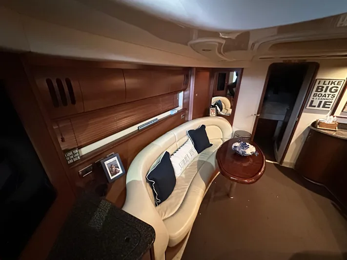  Yacht Photos Pics Luxurious interior of 2007 Sea Ray 44 Sundancer yacht with plush seating and elegant decor.