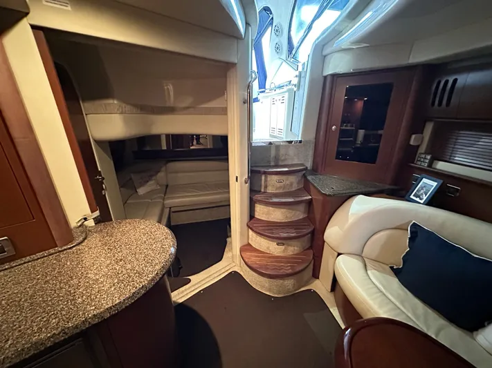  Yacht Photos Pics Interior of 2007 Sea Ray 44 Sundancer yacht with elegant seating and wooden steps.