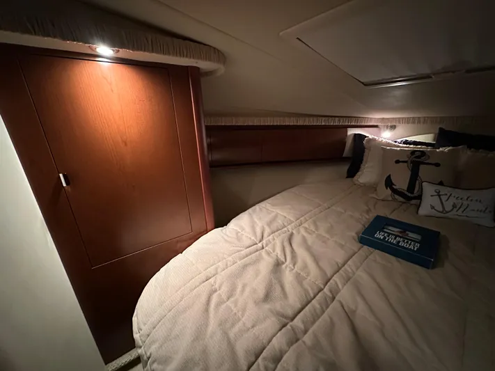  Yacht Photos Pics Cozy cabin interior of 2007 Sea Ray 44 Sundancer with plush bedding and ambient lighting.