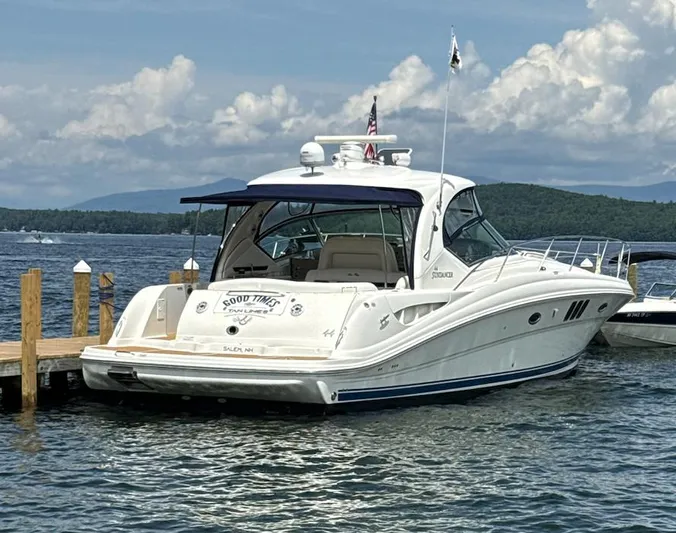  Yacht Photos Pics 2007 Sea Ray 44 Sundancer yacht docked on a scenic lake with mountains.