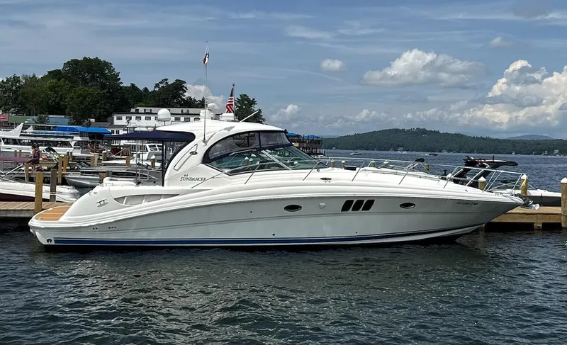  Yacht Photos Pics 2007 Sea Ray 44 Sundancer yacht docked at a marina on a sunny day.