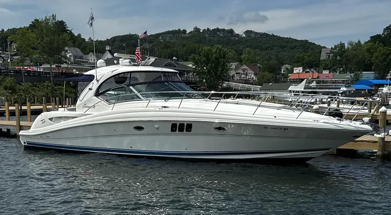  Yacht Photos Pics 2007 Sea Ray 44 Sundancer yacht docked at a marina with scenic background.