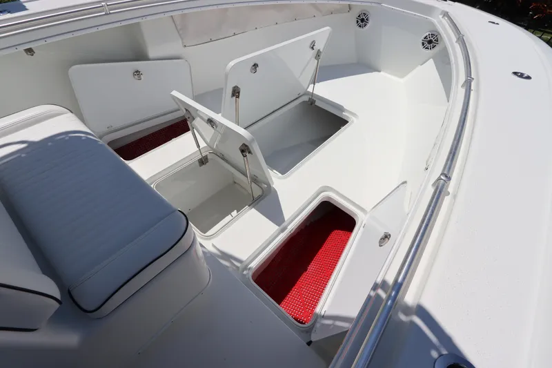  Yacht Photos Pics 2013 Yellowfin 32 Offshore boat with open storage compartments and seating area.