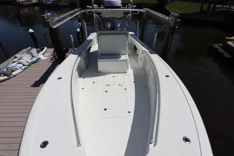  Yacht Photos Pics 2013 Yellowfin 32 Offshore boat docked, showcasing spacious deck and seating area.