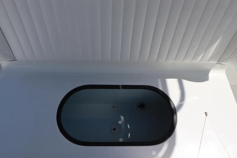  Yacht Photos Pics 2013 Yellowfin 32 Offshore boat interior with open storage compartment.