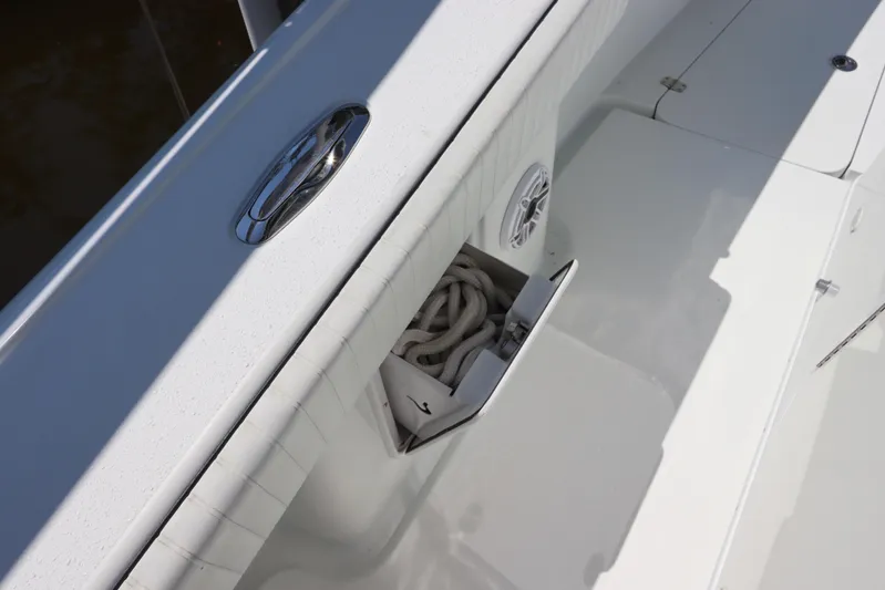 Yacht Photos Pics 2013 Yellowfin 32 Offshore boat deck with rope storage and speaker detail.