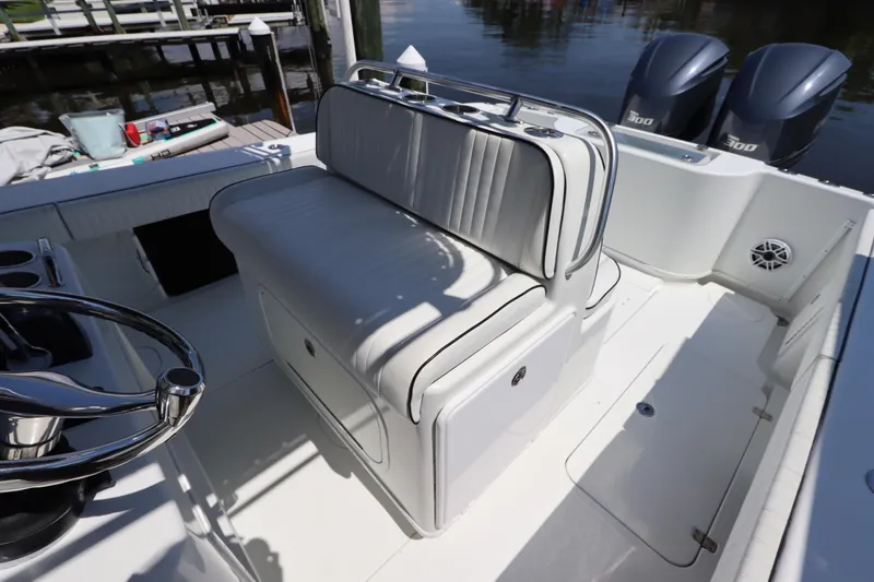  Yacht Photos Pics 2013 Yellowfin 32 Offshore boat interior with seating and dual engines.
