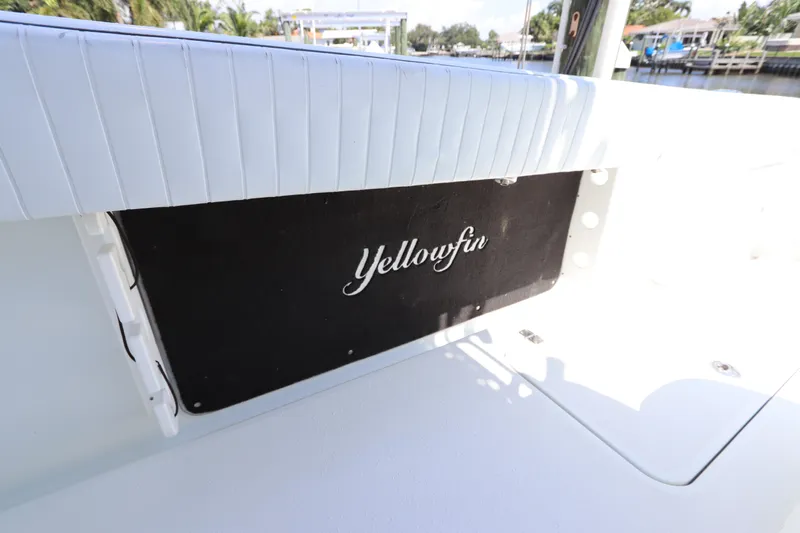  Yacht Photos Pics 2013 Yellowfin 32 Offshore boat interior with logo, featuring white and black design.