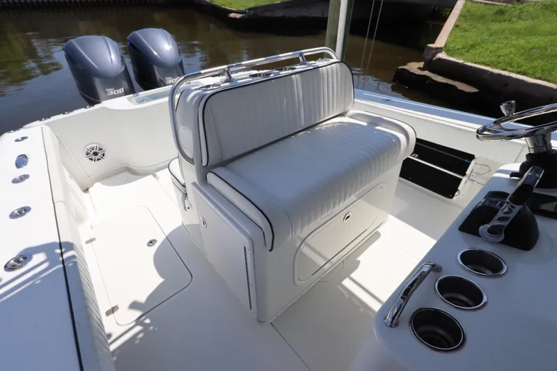  Yacht Photos Pics 2013 Yellowfin 32 Offshore boat interior with dual engines and white seating.