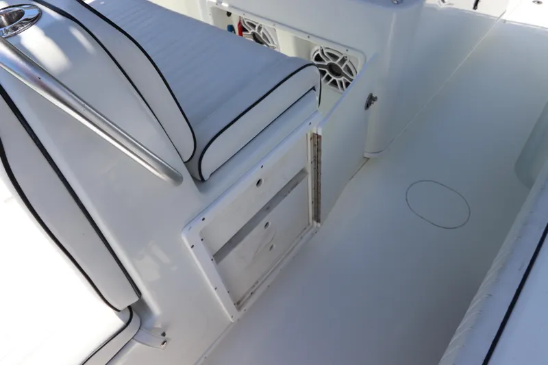  Yacht Photos Pics 2013 Yellowfin 32 Offshore boat interior with white seating and storage compartments.
