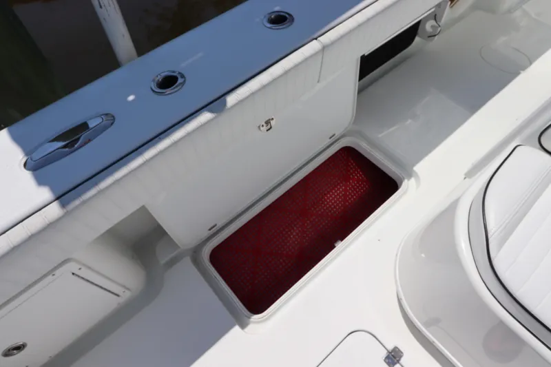  Yacht Photos Pics 2013 Yellowfin 32 Offshore boat deck with open storage compartment.