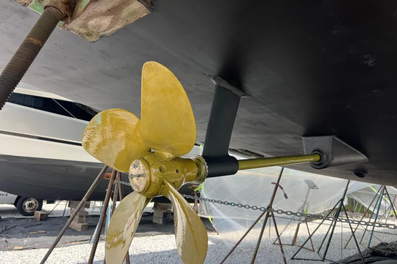  Yacht Photos Pics 2023 Jeanneau 65 yacht propeller and hull detail in a boatyard setting.