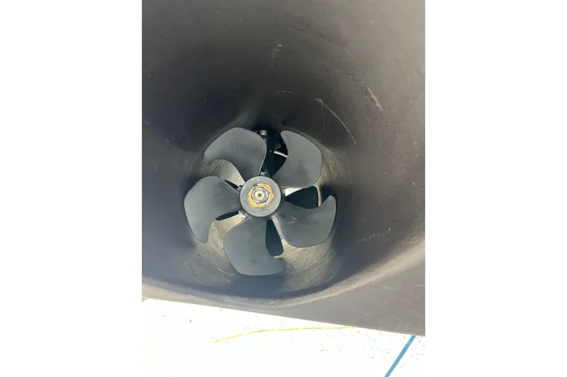 Yacht Photos Pics Close-up of a 2023 Jeanneau 65 boat propeller in a tunnel.