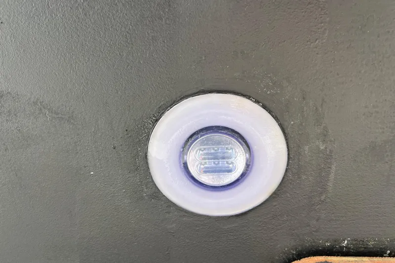  Yacht Photos Pics Close-up of a 2023 Jeanneau 65 boat's underwater light fixture.