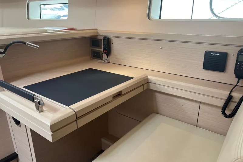  Yacht Photos Pics Interior of 2023 Jeanneau 65 yacht with navigation desk and communication equipment.