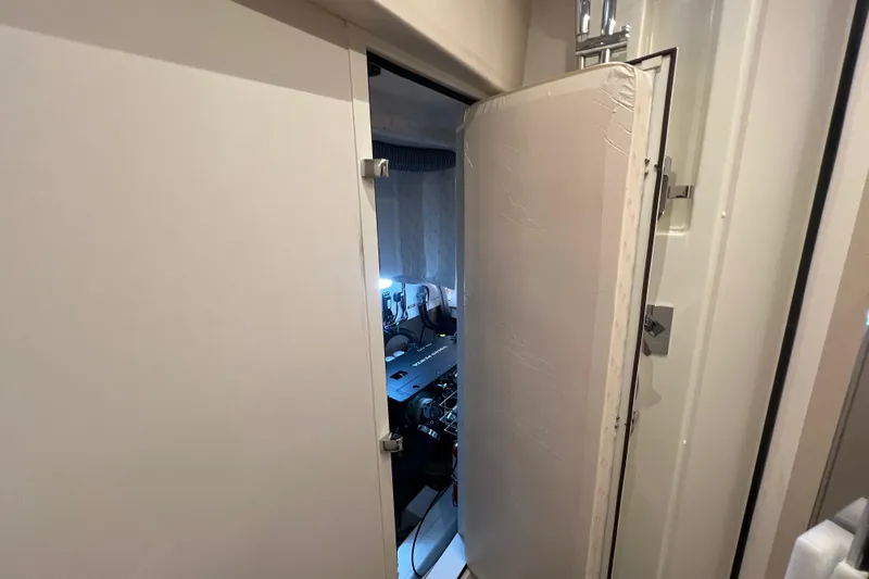  Yacht Photos Pics Engine room access door on a 2023 Jeanneau 65 yacht, partially open.
