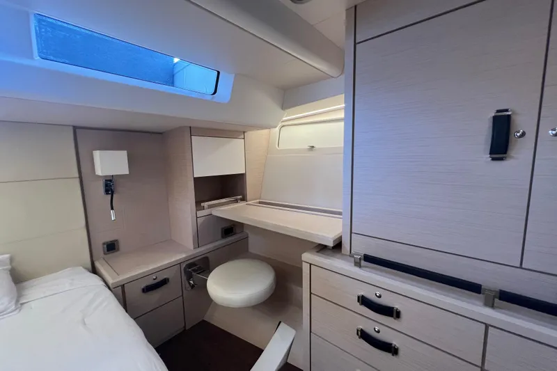  Yacht Photos Pics Luxurious interior cabin of 2023 Jeanneau 65 yacht with modern furnishings.