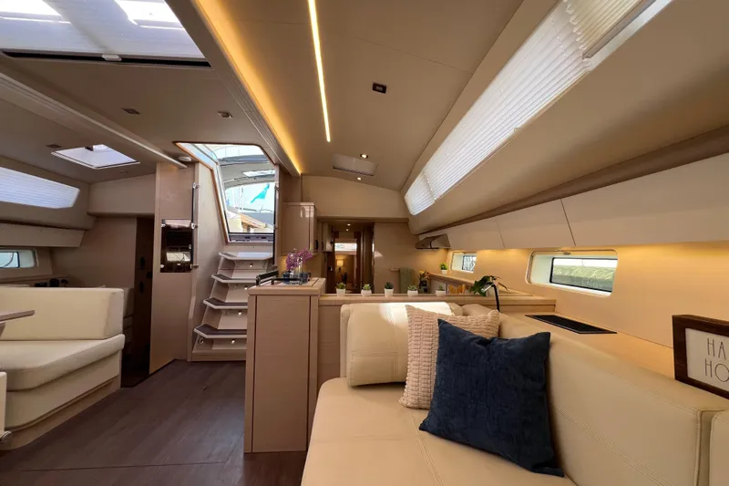  Yacht Photos Pics Luxurious interior of 2023 Jeanneau 65 yacht with modern design and comfortable seating.