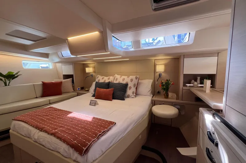  Yacht Photos Pics Luxurious interior of 2023 Jeanneau 65 yacht with elegant bedroom and modern decor.