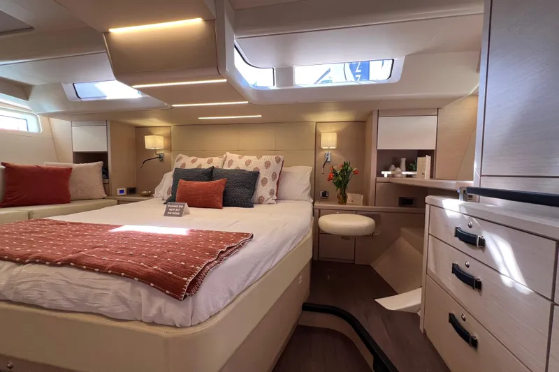  Yacht Photos Pics Luxurious interior of 2023 Jeanneau 65 yacht with elegant bedroom design.