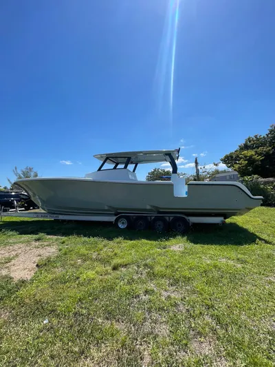  Yacht Photos Pics 2026 Streamline 45 boat on trailer under clear blue sky.