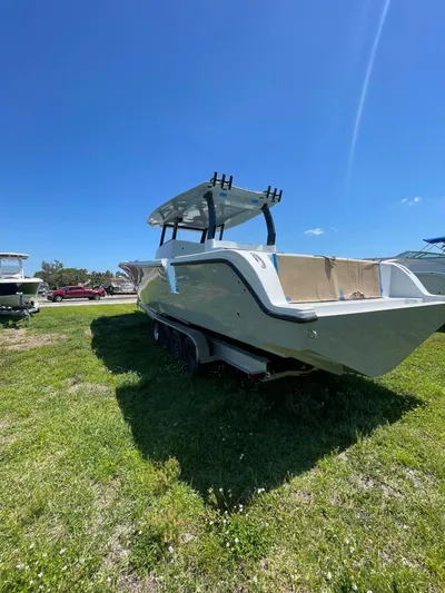  Yacht Photos Pics 2026 Streamline 45 boat on grass under clear blue sky.