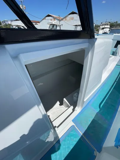  Yacht Photos Pics Streamline 45 boat, 2026 model, open hatch, docked at marina under clear blue sky.