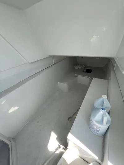  Yacht Photos Pics Interior of 2026 Streamline 45 boat with minimalist design and cleaning supplies.
