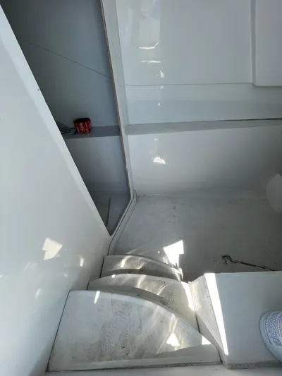  Yacht Photos Pics Interior of a 2026 Streamline 45 boat, featuring sleek white surfaces and compact design.