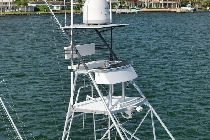  Yacht Photos Pics 1997 Garlington 61 yacht tower with radar, overlooking calm waters and waterfront homes.