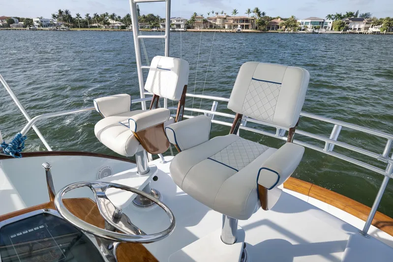  Yacht Photos Pics Luxury seating on a 1997 Garlington 61 yacht, overlooking serene waterfront homes.