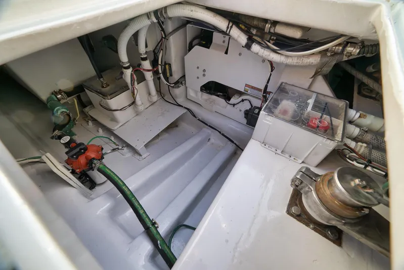  Yacht Photos Pics Engine compartment of a 1997 Garlington 61 boat, showcasing mechanical components and wiring.