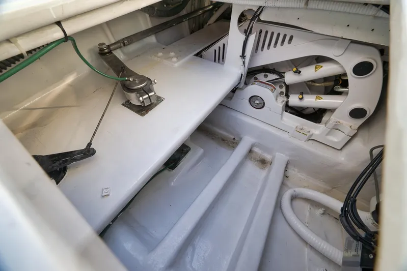  Yacht Photos Pics Engine compartment of a 1997 Garlington 61 boat, showcasing mechanical components and wiring.