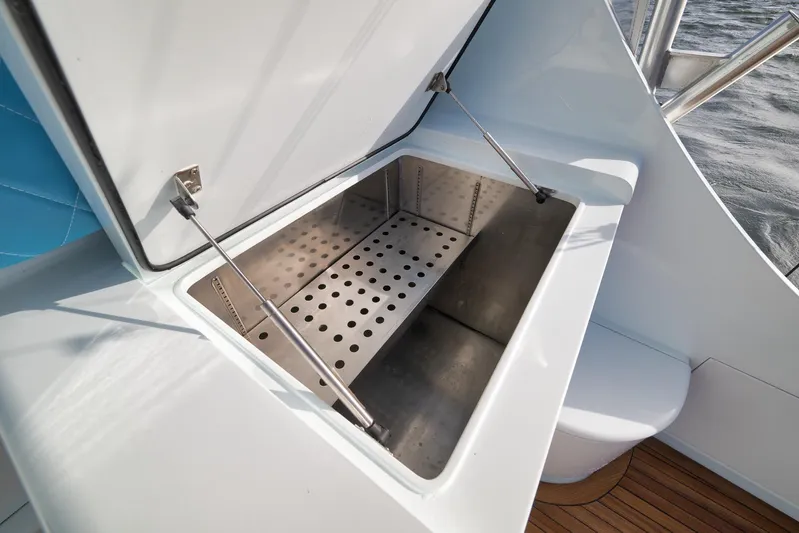  Yacht Photos Pics Open storage compartment on 1997 Garlington 61 boat with metal interior.