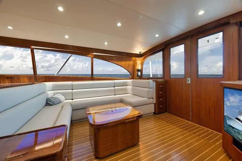  Yacht Photos Pics Luxurious 1997 Garlington 61 yacht interior with elegant wood finish and plush seating.