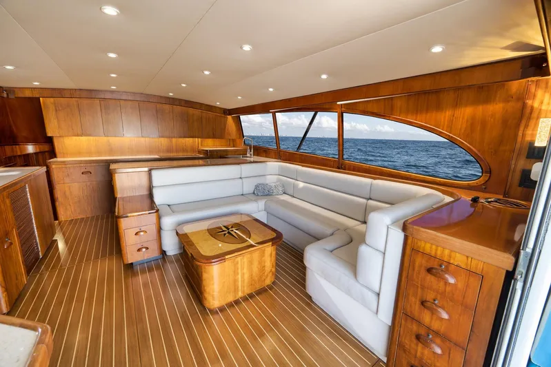  Yacht Photos Pics Luxurious 1997 Garlington 61 yacht interior with elegant wood finish and plush seating.