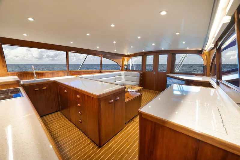  Yacht Photos Pics Luxurious 1997 Garlington 61 yacht interior with elegant wood finishes and ocean view.