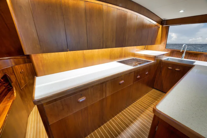  Yacht Photos Pics Luxurious wooden yacht kitchen interior with modern appliances, Garlington 61, 1997 model.