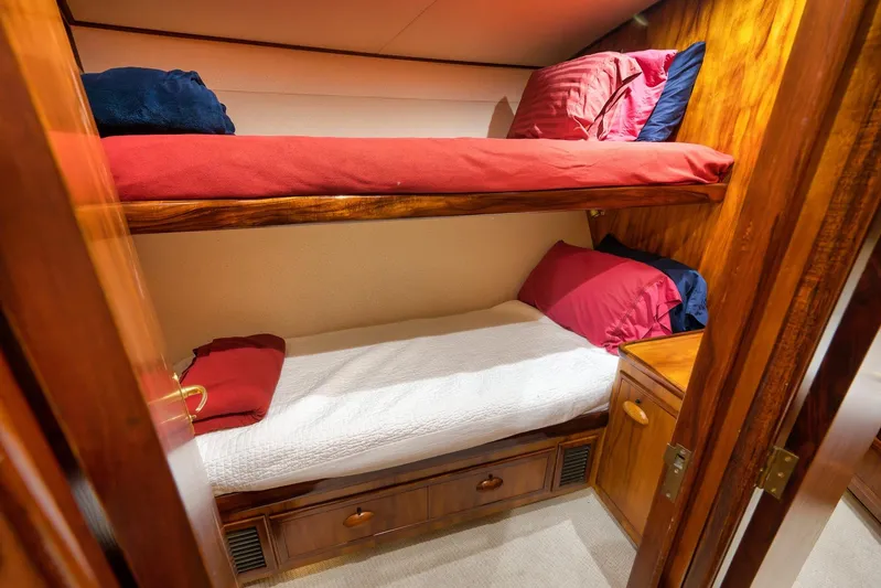  Yacht Photos Pics Cozy wooden bunk beds in a 1997 Garlington 61 yacht cabin.