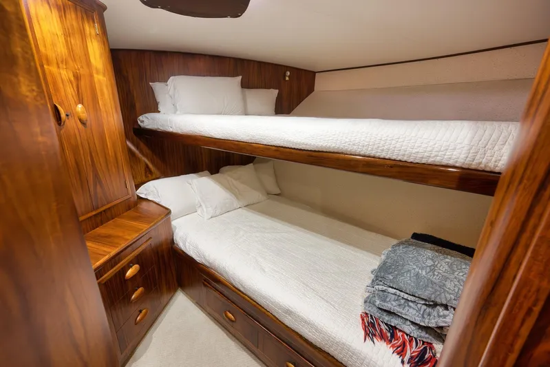  Yacht Photos Pics Cozy wooden bunk beds in a 1997 Garlington 61 yacht cabin.
