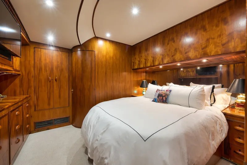  Yacht Photos Pics Luxurious wooden cabin interior on a 1997 Garlington 61 yacht, featuring a cozy bed.