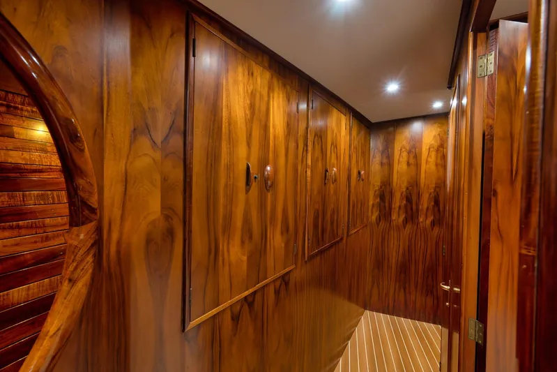  Yacht Photos Pics Luxurious wooden interior of a 1997 Garlington 61 yacht hallway with elegant paneling.