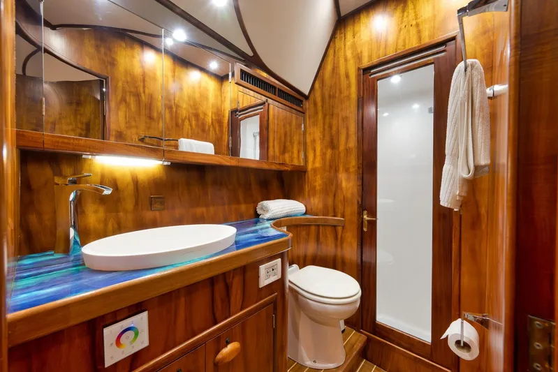  Yacht Photos Pics Luxurious wooden bathroom interior on a 1997 Garlington 61 yacht, featuring modern fixtures.