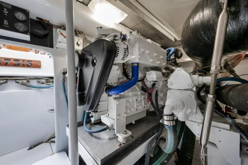  Yacht Photos Pics Engine room of a 1997 Garlington 61 boat, showcasing mechanical components and wiring.