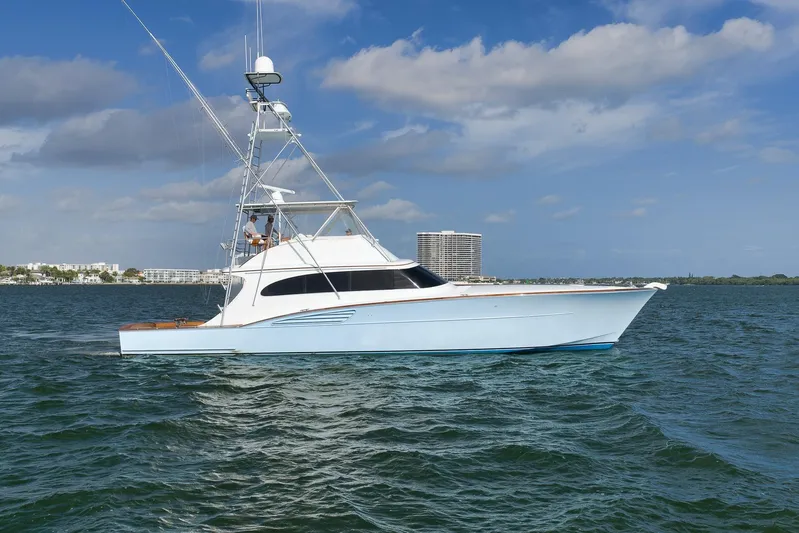  Yacht Photos Pics 1997 Garlington 61 yacht cruising on open water under a clear blue sky.