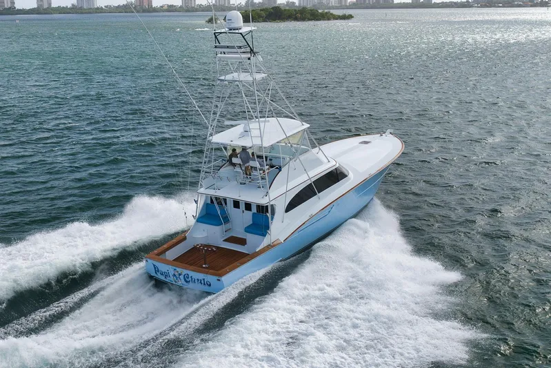  Yacht Photos Pics 1997 Garlington 61 yacht cruising on open water, showcasing sleek design and powerful performance.