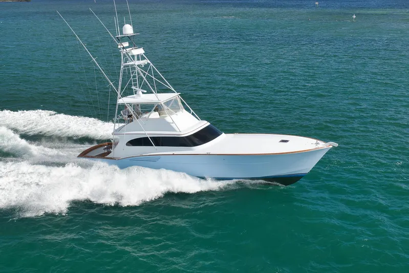  Yacht Photos Pics 1997 Garlington 61 yacht cruising on open water, showcasing sleek design and powerful performance.